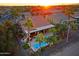 Wonderful aerial view of a home with a private pool, covered patio, and outdoor kitchen area at 15954 W Sheila Ln, Goodyear, AZ 85395