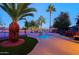 Backyard pool and patio with beautiful palm trees at 15954 W Sheila Ln, Goodyear, AZ 85395