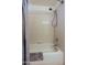 A tiled bath and shower combo featuring a shower curtain and adjustable shower head at 15954 W Sheila Ln, Goodyear, AZ 85395