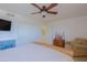 Bedroom with light walls, a ceiling fan, and a sliding-door closet at 15954 W Sheila Ln, Goodyear, AZ 85395