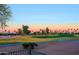 Scenic golf course view showcasing lush greenery and a beautiful sunset backdrop at 15954 W Sheila Ln, Goodyear, AZ 85395