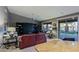 Spacious living room with large windows, stylish furnishings, and backyard views at 15954 W Sheila Ln, Goodyear, AZ 85395