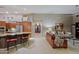 Open floor plan featuring kitchen with island bar and living area, perfect for entertaining at 15954 W Sheila Ln, Goodyear, AZ 85395