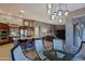 Open-concept living space seamlessly connects the kitchen, dining area, and living room, ideal for entertaining at 15954 W Sheila Ln, Goodyear, AZ 85395