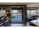 Bright open layout with a kitchen island, living area with backyard views and access to the outdoor patio at 15954 W Sheila Ln, Goodyear, AZ 85395
