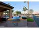 Outdoor kitchen featuring a built-in BBQ grill and views of the golf course at 15954 W Sheila Ln, Goodyear, AZ 85395