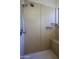 Walk-in shower features tile surround and a bench. Handheld shower head and built in shower caddy at 15954 W Sheila Ln, Goodyear, AZ 85395