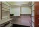Well-organized walk-in closet with custom shelving, desk area, and ample storage at 15954 W Sheila Ln, Goodyear, AZ 85395