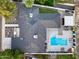 Aerial view of property featuring pool, covered patio, putting green and low maintenance landscaping at 1609 W State Ave, Phoenix, AZ 85021