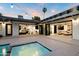 Backyard with a pool and jacuzzi that connects to an open floorplan, perfect for seamless indoor-outdoor living at 1609 W State Ave, Phoenix, AZ 85021