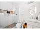 Bright bathroom featuring white tiling in the walk-in shower and marble sink top at 1609 W State Ave, Phoenix, AZ 85021