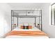 Cozy bedroom with a bunk bed and a comfortable queen-sized mattress below at 1609 W State Ave, Phoenix, AZ 85021