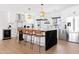 Bright kitchen with white cabinets, black countertops and stainless steel appliances at 1609 W State Ave, Phoenix, AZ 85021