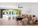 Beautiful living room featuring a ceiling fan, an open view to the pool, and modern furnishings at 1609 W State Ave, Phoenix, AZ 85021