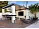 Enjoy outdoor living with a built-in kitchen, TV, fireplace and ample seating for entertaining at 1609 W State Ave, Phoenix, AZ 85021