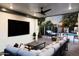 Inviting outdoor living space with a covered patio, comfortable seating, and a cozy fire pit area at 1609 W State Ave, Phoenix, AZ 85021