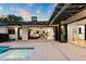 Charming patio with an open floorplan, seamlessly blending indoor and outdoor living with views of the inviting pool at 1609 W State Ave, Phoenix, AZ 85021