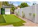 Backyard putting green offering a fun, recreational amenity with professionally manicured artificial turf at 1609 W State Ave, Phoenix, AZ 85021