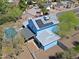 Aerial view of the home with solar panels, and surrounding neighborhood at 16256 N 64Th Pl, Scottsdale, AZ 85254