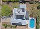 An aerial view of a home showcasing solar panels, a pristine pool and landscaping at 16256 N 64Th Pl, Scottsdale, AZ 85254