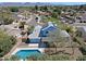Stunning aerial view of home with solar panels, a pool, and mountain views at 16256 N 64Th Pl, Scottsdale, AZ 85254