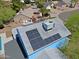 Bird's eye view of home with solar panels, landscaping, and surrounding houses at 16256 N 64Th Pl, Scottsdale, AZ 85254