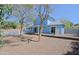 Large backyard, partial view of the home, pool, landscaping, and fencing at 16256 N 64Th Pl, Scottsdale, AZ 85254