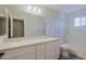 Bathroom with double sinks, white cabinets, and a shower/tub combo at 16256 N 64Th Pl, Scottsdale, AZ 85254