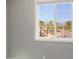 Bedroom window with views of trees and mountains at 16256 N 64Th Pl, Scottsdale, AZ 85254