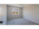 This carpeted bedroom has neutral walls and bright natural light at 16256 N 64Th Pl, Scottsdale, AZ 85254