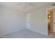 Neutral bedroom features plush carpet, a closet door, and an open doorway at 16256 N 64Th Pl, Scottsdale, AZ 85254