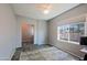 Cozy bedroom with a ceiling fan and window overlooking the neighborhood at 16256 N 64Th Pl, Scottsdale, AZ 85254