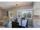 Open dining room and kitchen with bay window and access to the backyard through a sliding glass door at 16256 N 64Th Pl, Scottsdale, AZ 85254