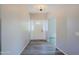Inviting foyer with decorative lighting, elegant front door with sidelights, and wood-look flooring at 16256 N 64Th Pl, Scottsdale, AZ 85254