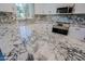 Bright kitchen features granite countertops, stainless steel appliances, white cabinets, and lots of space at 16256 N 64Th Pl, Scottsdale, AZ 85254
