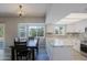 Modern kitchen with an island, granite countertops, stainless steel appliances, and natural light at 16256 N 64Th Pl, Scottsdale, AZ 85254