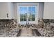 Kitchen sink and granite countertops in front of a window with a view to the backyard and pool at 16256 N 64Th Pl, Scottsdale, AZ 85254