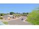 Neighborhood view of desert landscape with palm trees and blue mountains at 16256 N 64Th Pl, Scottsdale, AZ 85254