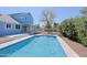 Backyard pool and patio area with fencing and landscaping at 16256 N 64Th Pl, Scottsdale, AZ 85254