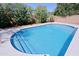 Swimming pool with staircase and surrounding landscape at 16256 N 64Th Pl, Scottsdale, AZ 85254