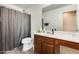 Bathroom with a shower-tub, toilet, and vanity sink with storage space at 16562 W Sierra St, Surprise, AZ 85388