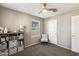 Comfortable bedroom with neutral walls, and a ceiling fan, well-lit by a window at 16562 W Sierra St, Surprise, AZ 85388