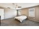Bright bedroom with a ceiling fan and windows offering great light and neutral walls at 16562 W Sierra St, Surprise, AZ 85388