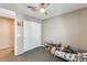 Bright bedroom with a closet, fan, and bed offers a cozy and functional space at 16562 W Sierra St, Surprise, AZ 85388
