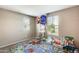 Comfortable bedroom with two windows and colorful rug, perfect for a room at 16562 W Sierra St, Surprise, AZ 85388