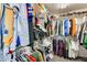 Walk-in closet with built-in shelves and hanging rods, providing ample storage space at 16562 W Sierra St, Surprise, AZ 85388
