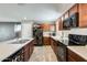 Modern kitchen featuring black appliances, and an island providing extra counter space at 16562 W Sierra St, Surprise, AZ 85388