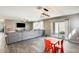 Open-concept living space with access to backyard and featuring table and chairs at 16562 W Sierra St, Surprise, AZ 85388