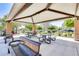 Covered picnic area with tables, benches, and barbecue grills in a community park at 16562 W Sierra St, Surprise, AZ 85388