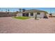Spacious backyard with low-maintenance gravel and green artificial turf at 17411 N 36Th St, Phoenix, AZ 85032